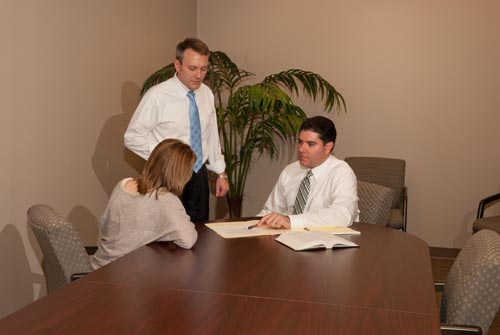 Attorneys meeting with a client
